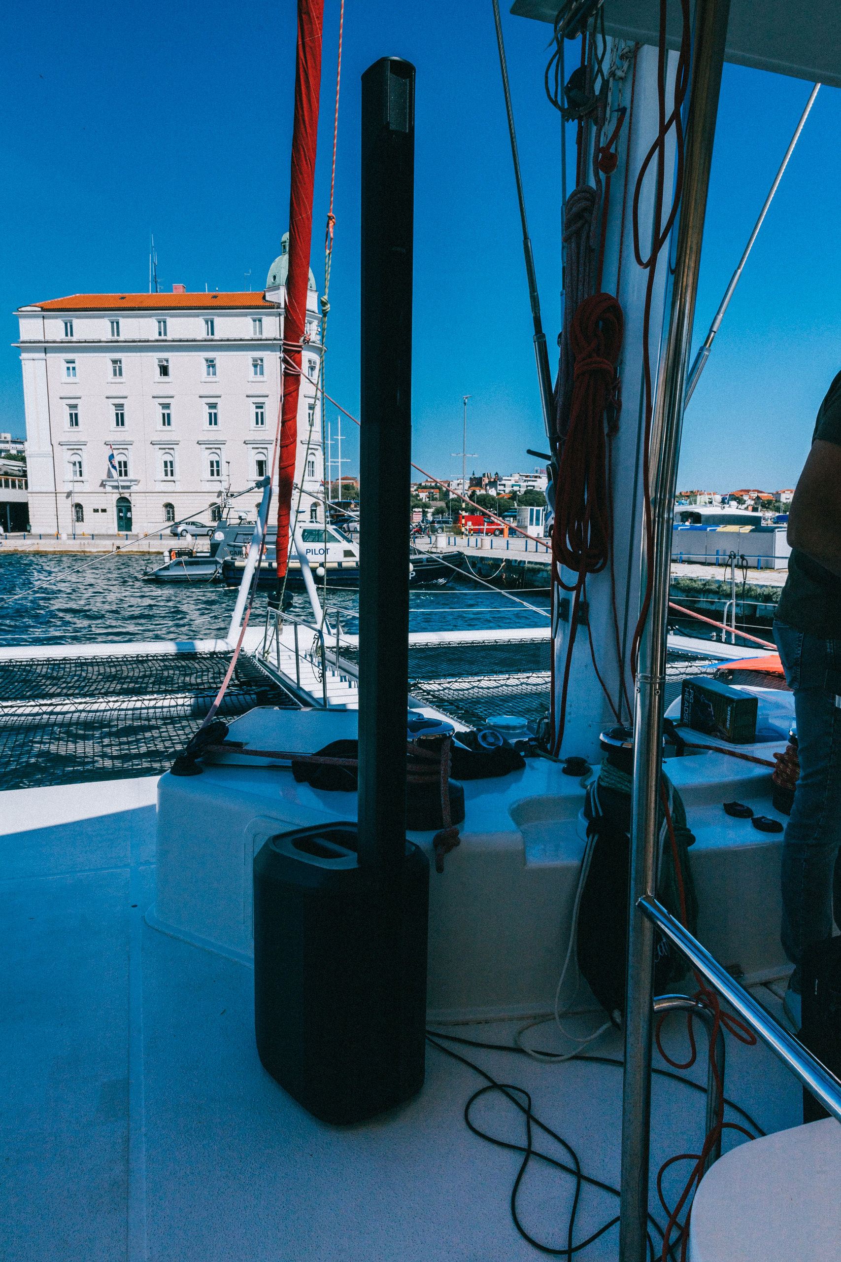 Bose speaker on catamaran deck with Split waterfront — island event audio setup