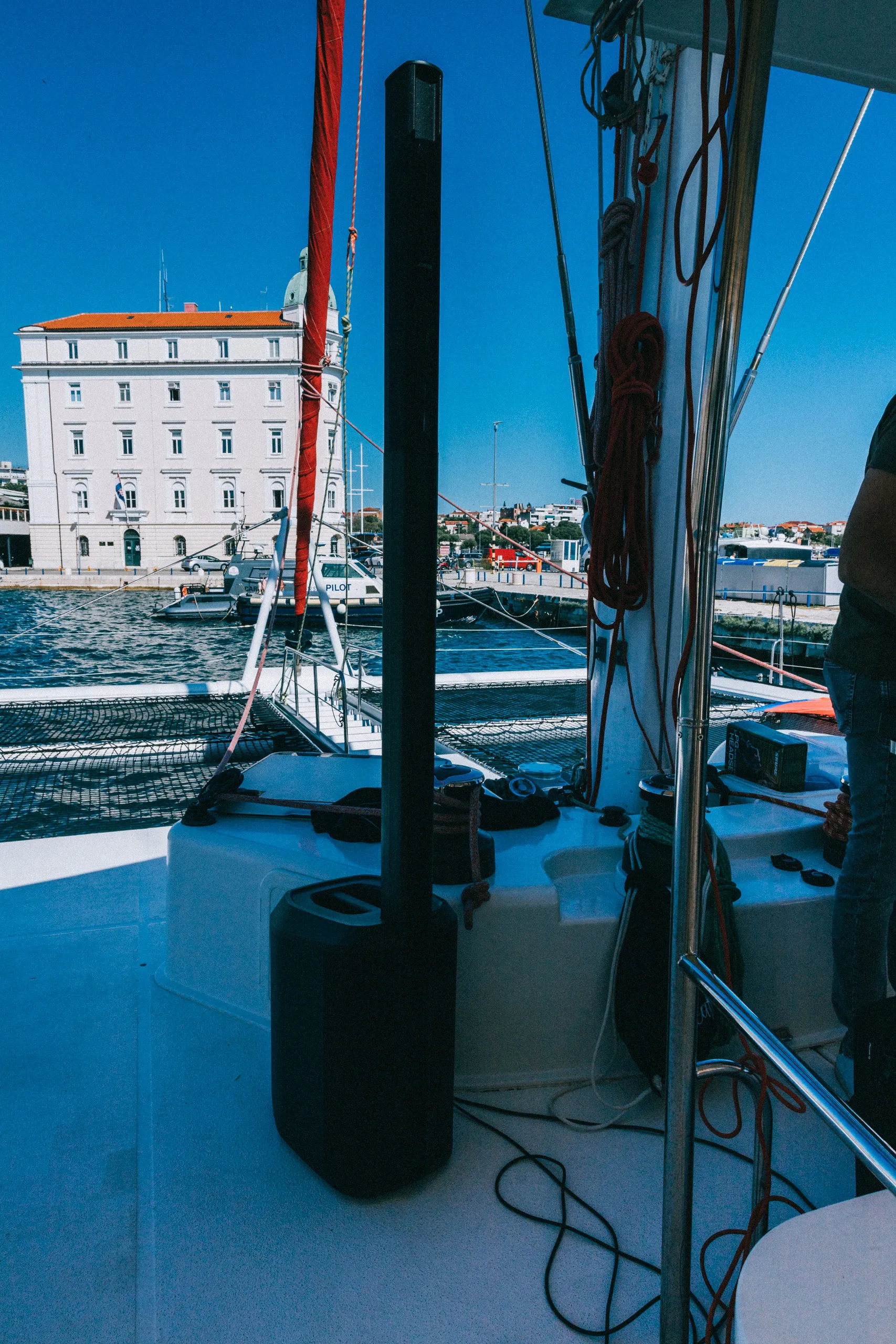 Bose speaker on a catamaran with Split waterfront in background at a Cosmic Production yacht event