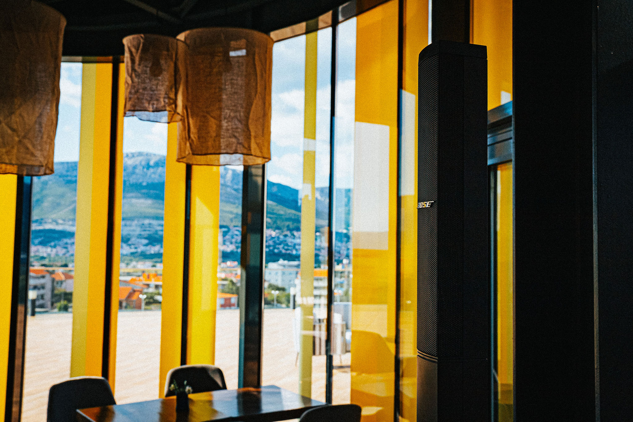 Bose speakers integrated into the interior of TIN rooftop restaurant in Split — panoramic view