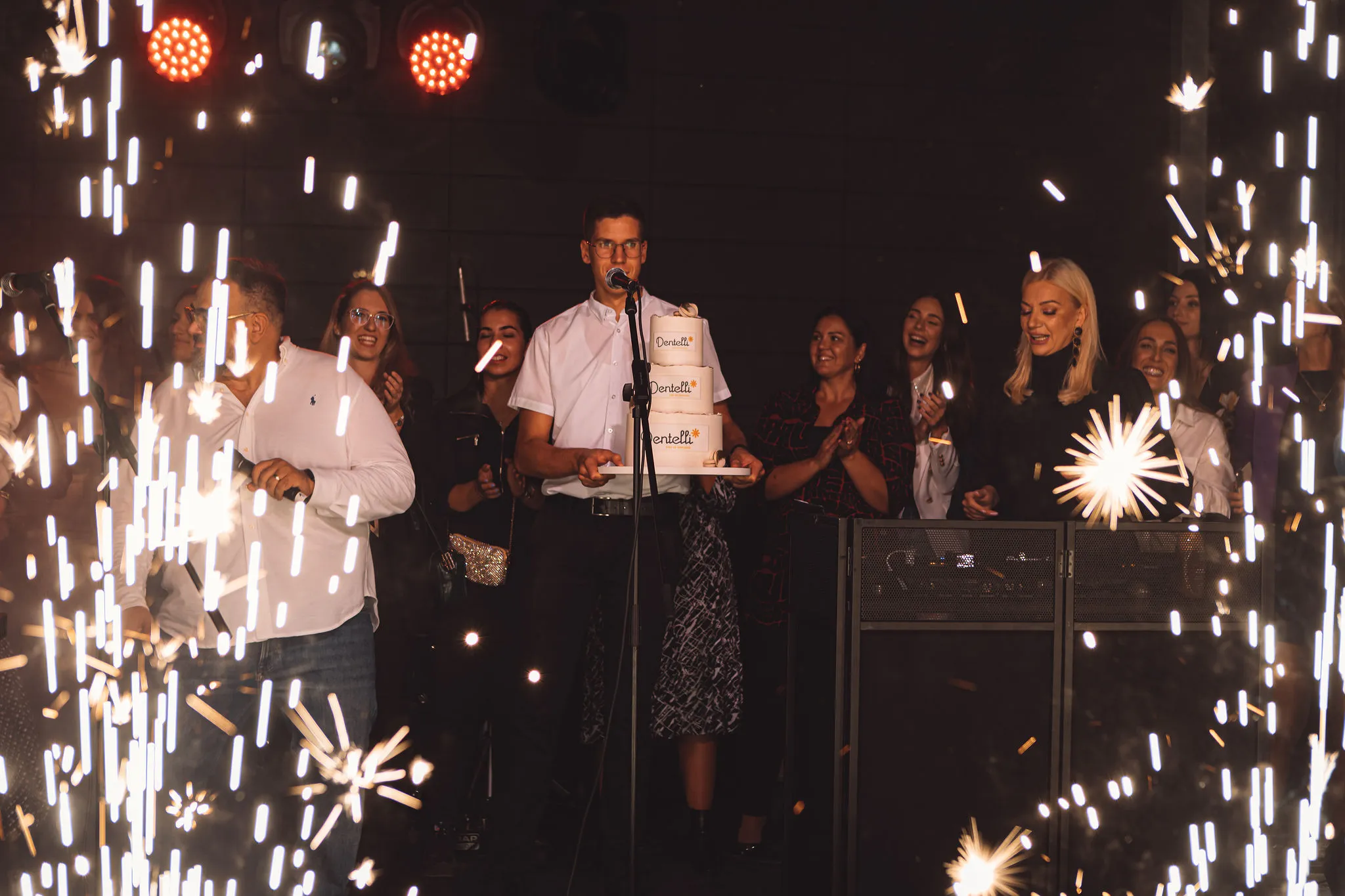 Cold sparkler pyrotechnics lighting up the dance floor at a Cosmic Production event