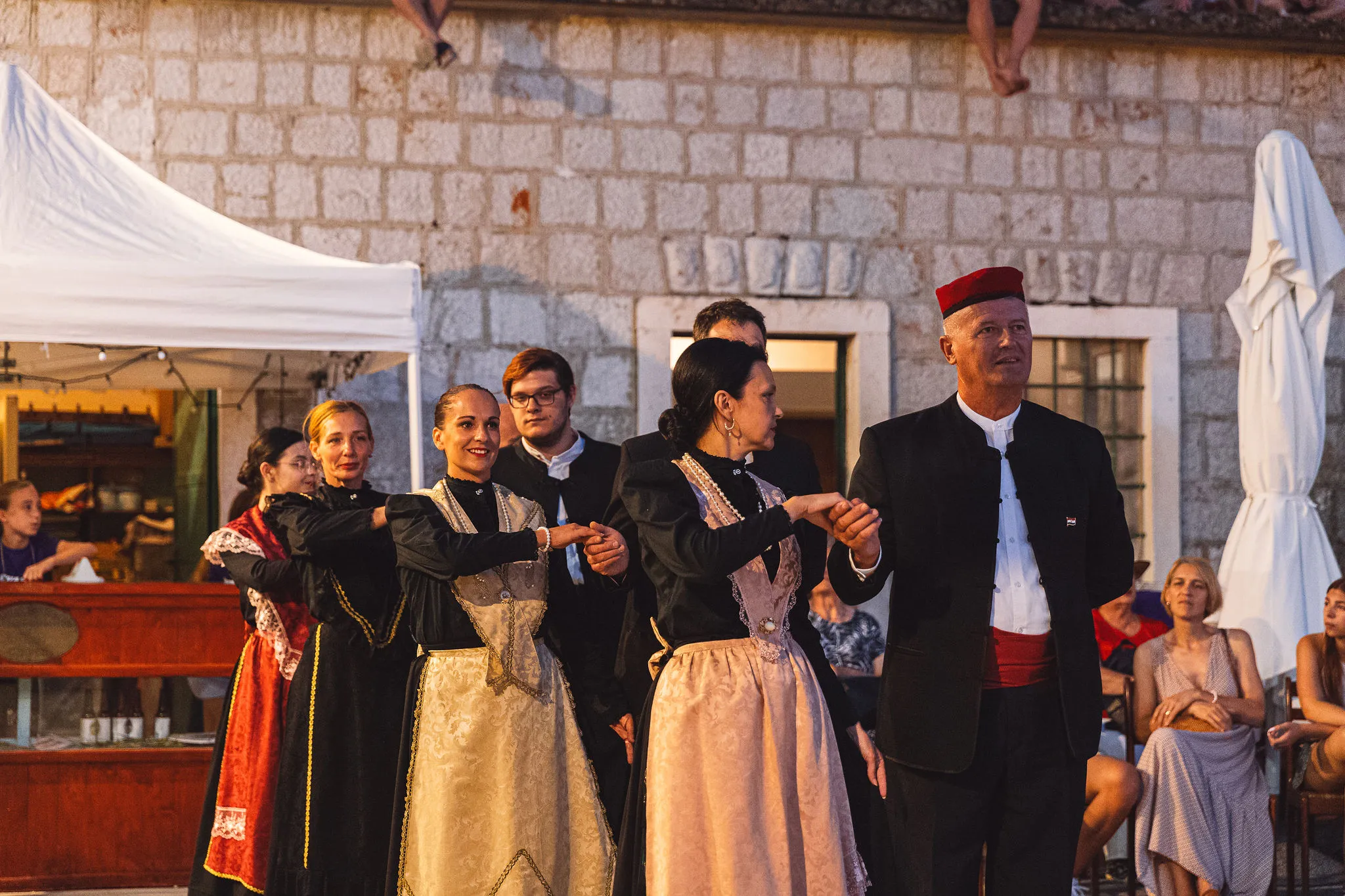 Croatian folk dance performers in traditional costume at a Hvar festival — Cosmic Production cultural entertainment