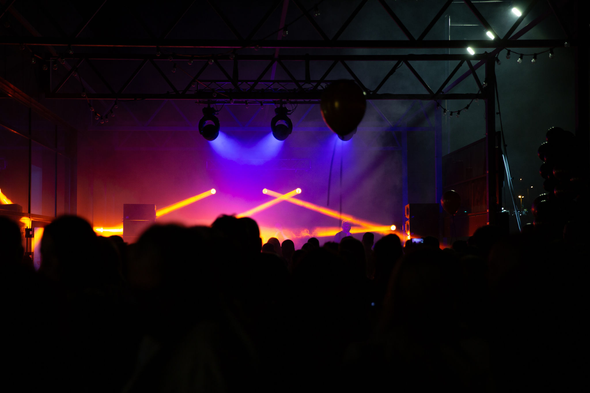 Crowd with hands up enjoying a party event produced by Cosmic Production