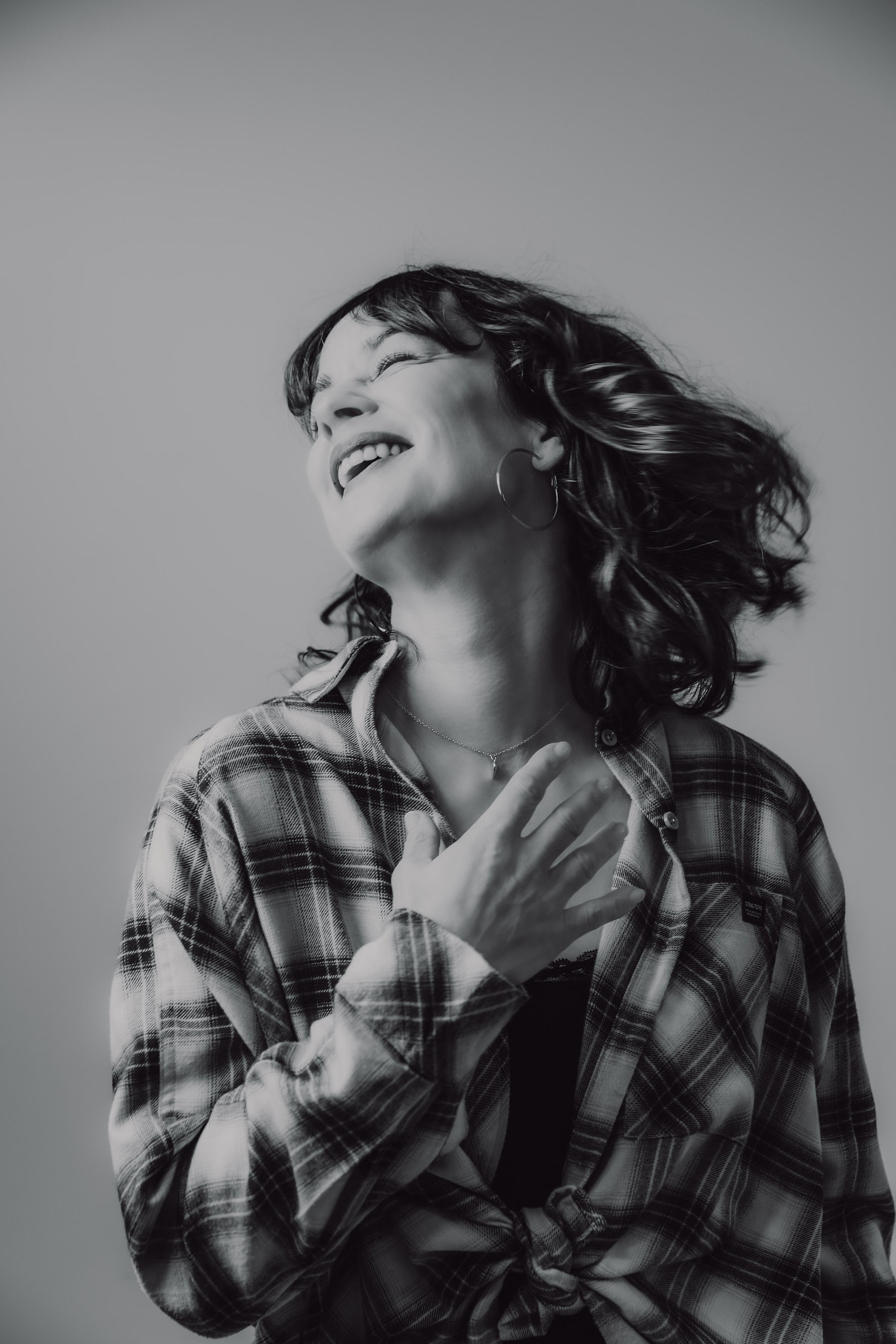 DJ K2B laughing during a set — female DJ from the Cosmic Production roster