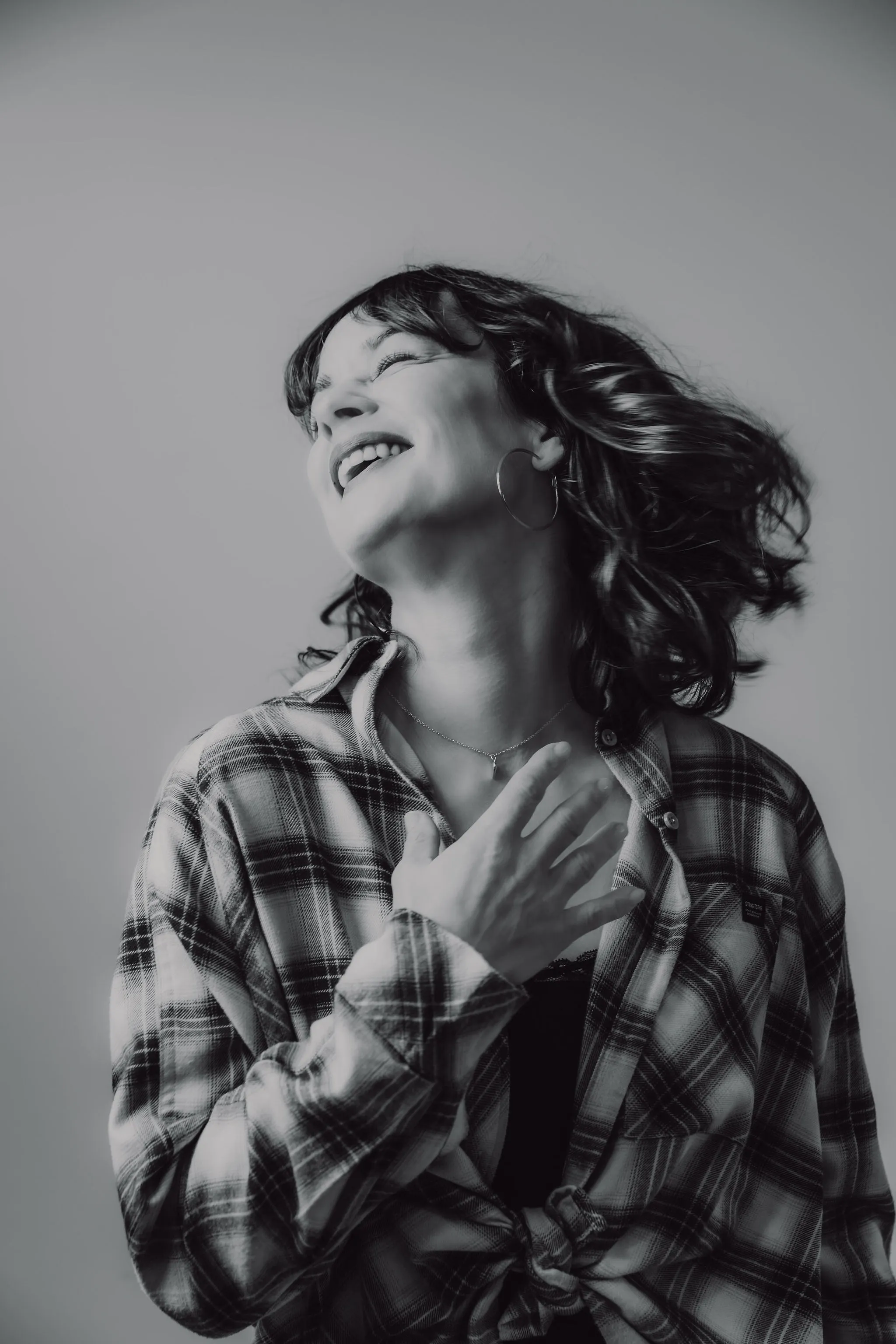 DJ K2B laughing during a set — female DJ from the Cosmic Production roster