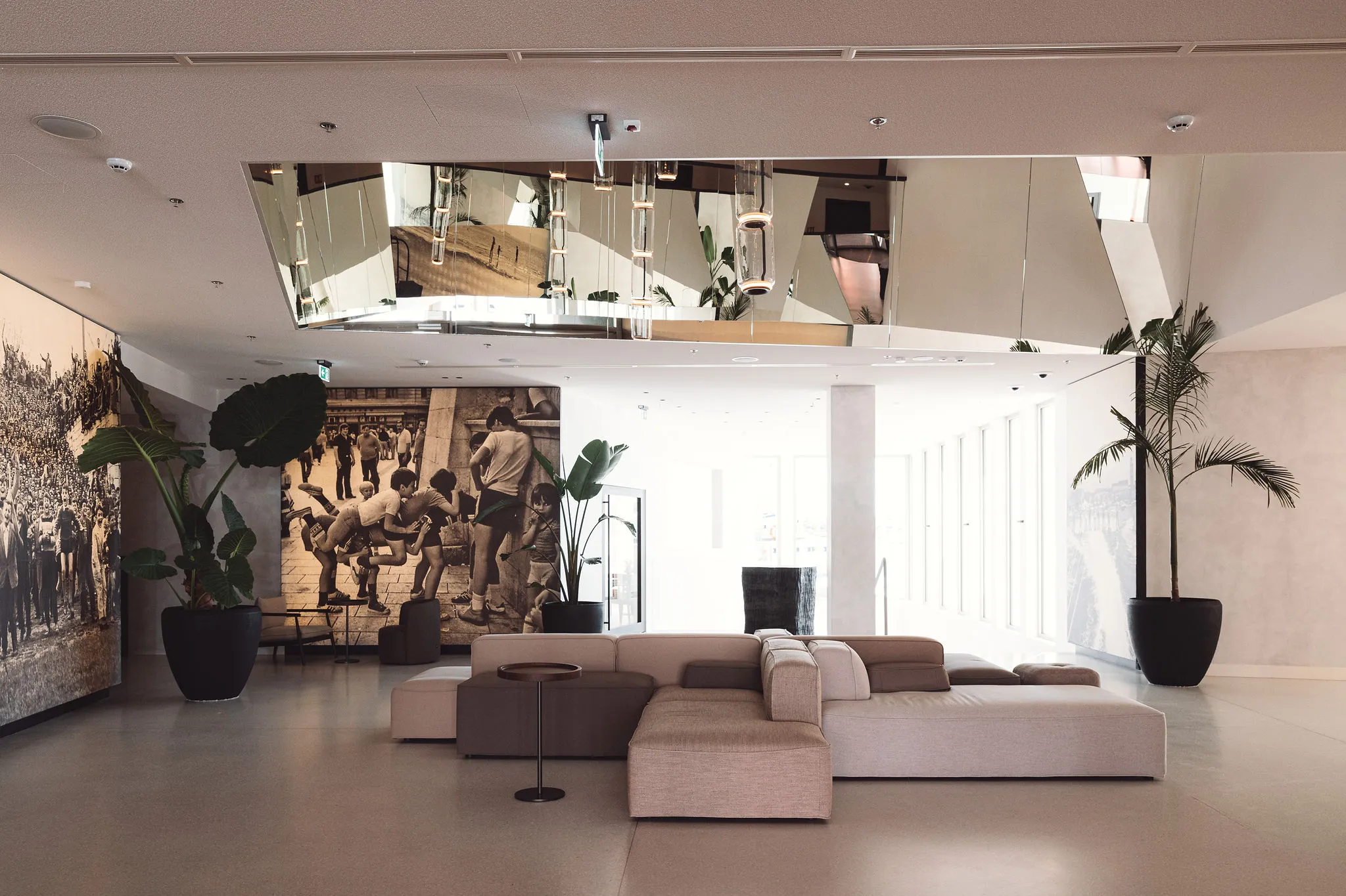 Hotel lobby atrium with Bose speakers and artistic murals — Cosmic Production AV integration