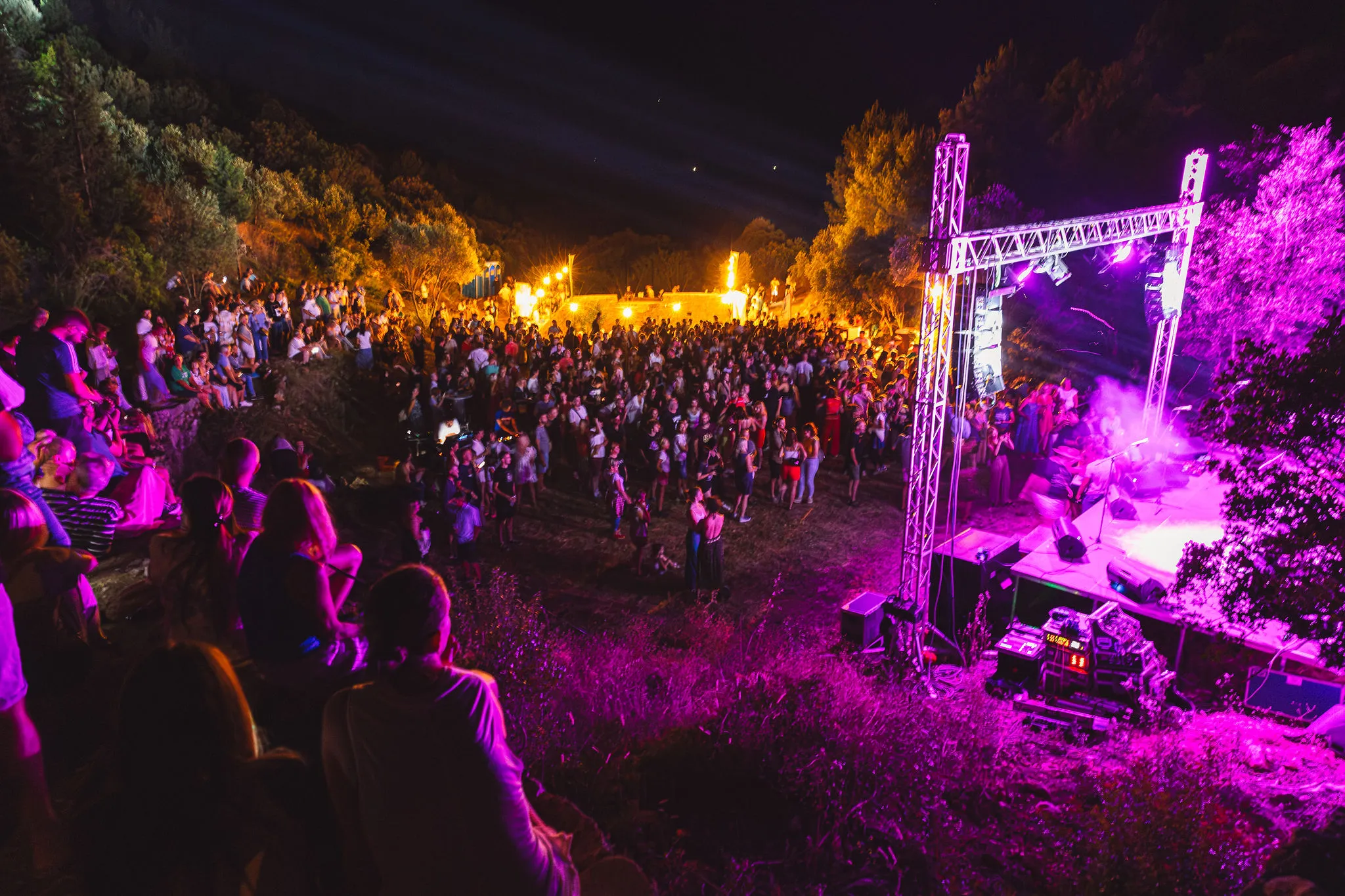 Lavender festival stage with crowd and purple lighting on Hvar island