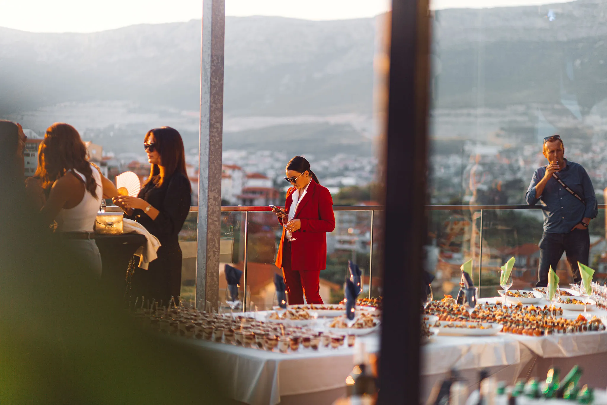 Rooftop terrace reception in Split with mountain views at golden hour — Cosmic Production corporate event