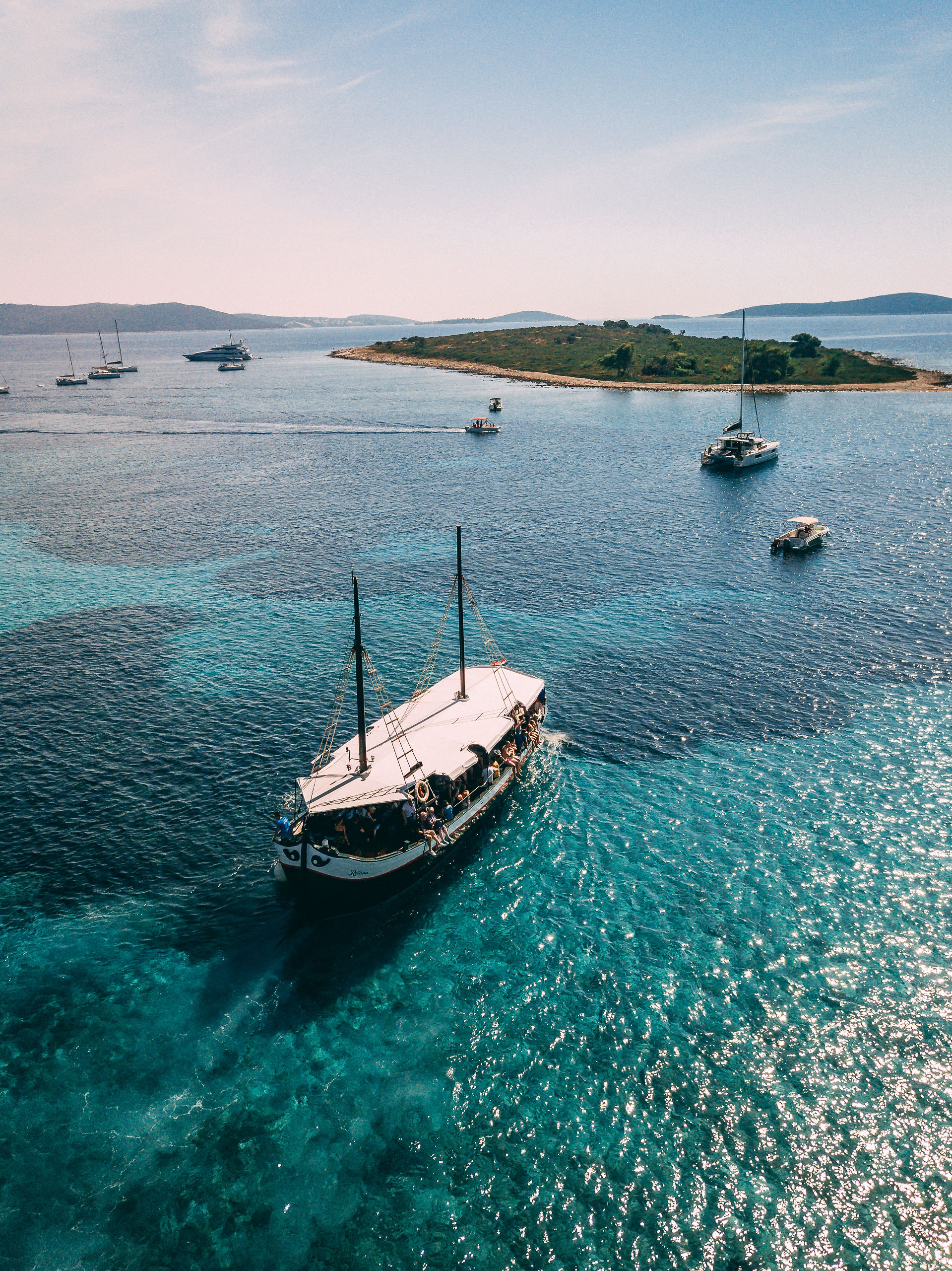 Traditional wooden boat on turquoise waters at Blue Lagoon Croatia