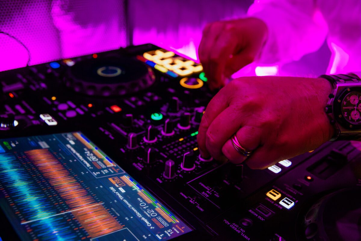 Rent a DJ in Croatia - Cosmic Production Agency - Closeup shot of a DJ playing a set on the Pioneer XZ at a yacht party in Croatia