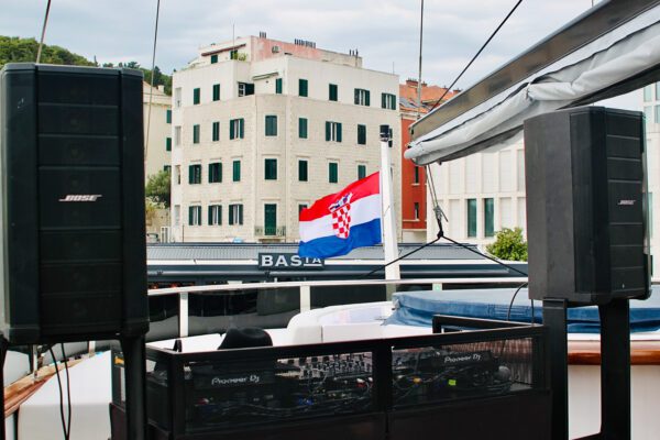 Event Production with DJ table with the Croatian Flag in the back